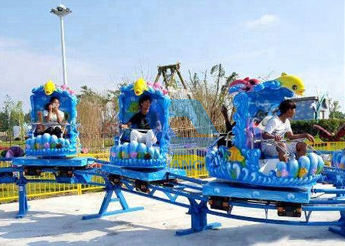 Outdoor Theme Park Roller Coaster , Kids Mini Roller Coaster Ocean Theme Spinning Sliding
